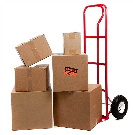 Moving boxes on a red dolly.
